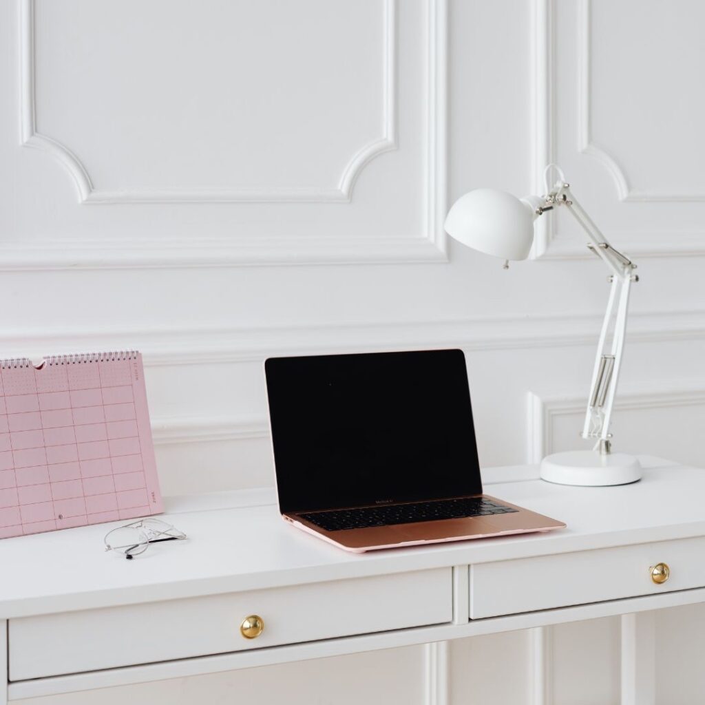 Laptop on desk with lamp